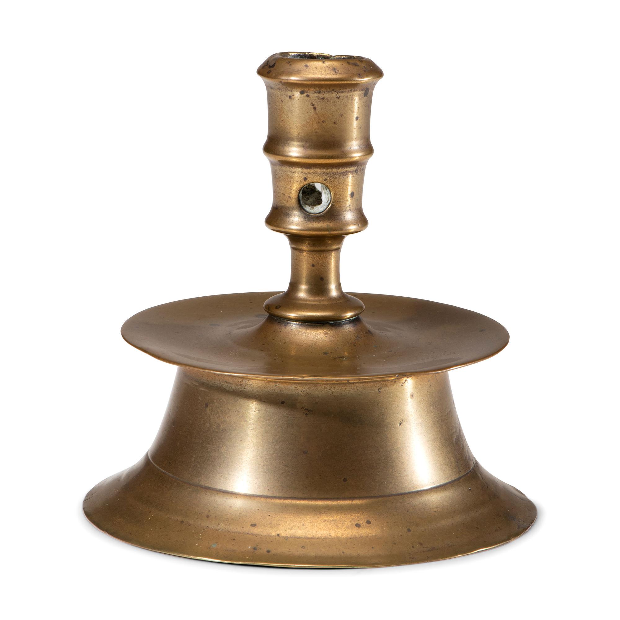 A Dutch Brass Heemskirk Candlestick