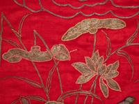 A Pair of Chinese Red Ground Embroidered Silk Panels