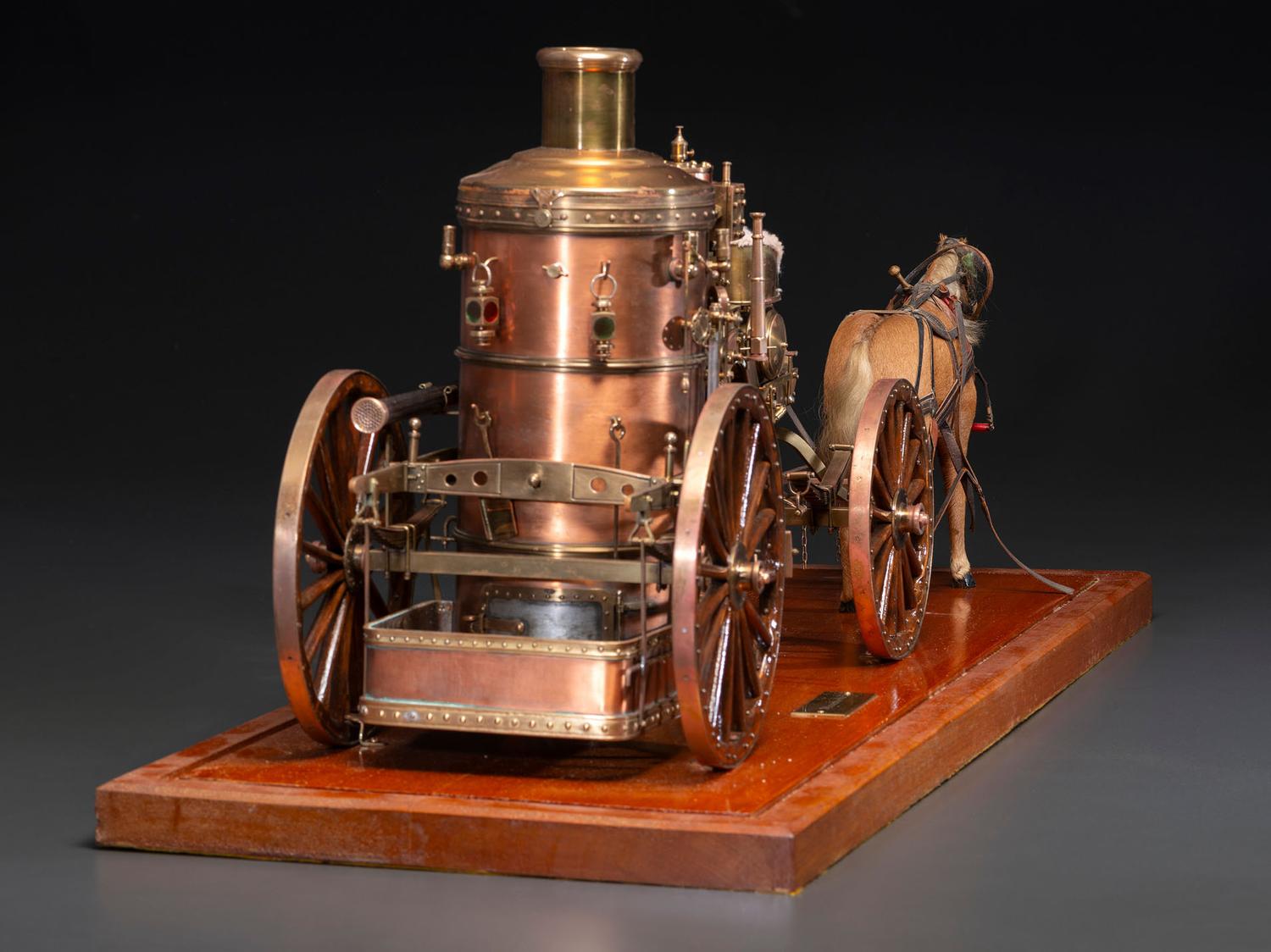 A Copper and Wood Horse-Drawn Steam-Powered Fire Engine Model