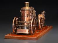 A Copper and Wood Horse-Drawn Steam-Powered Fire Engine Model
