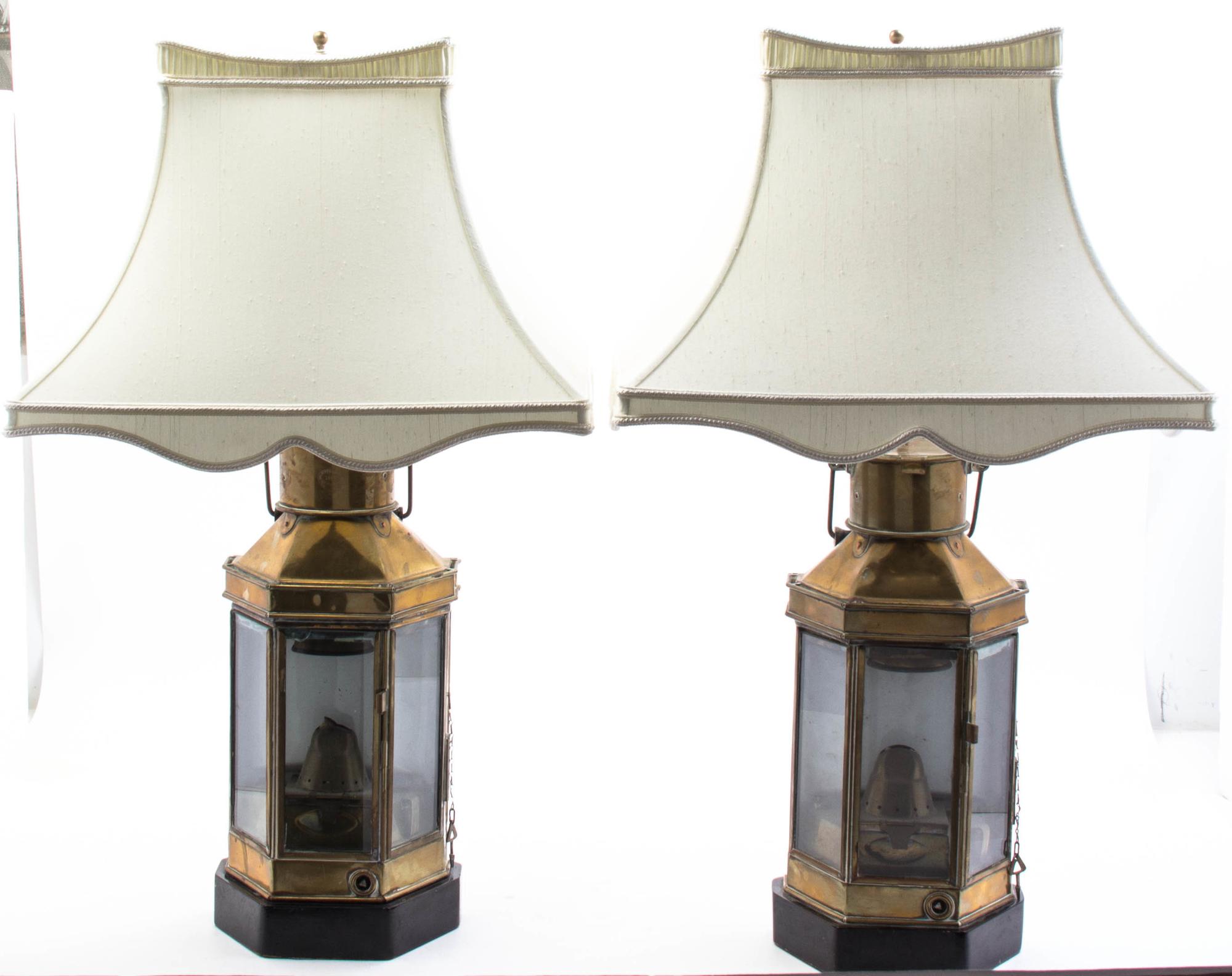 A Pair of Brass Ship Lanterns Height 32 1/2 inches.