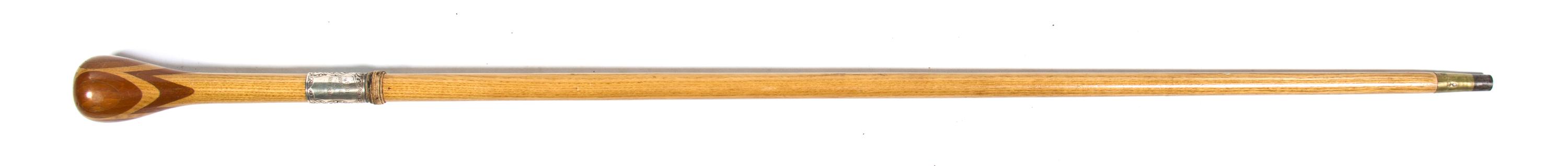 An English Silver Mounted Parquetry Walking Stick, M. Jacons & Co., Height overall 36 3/4 inches.
