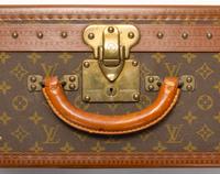 A Louis Vuitton Monogram Canvas Alzer Suitcase, 16" H x 23.5"W x 8.25"D; Handle drop: 2".