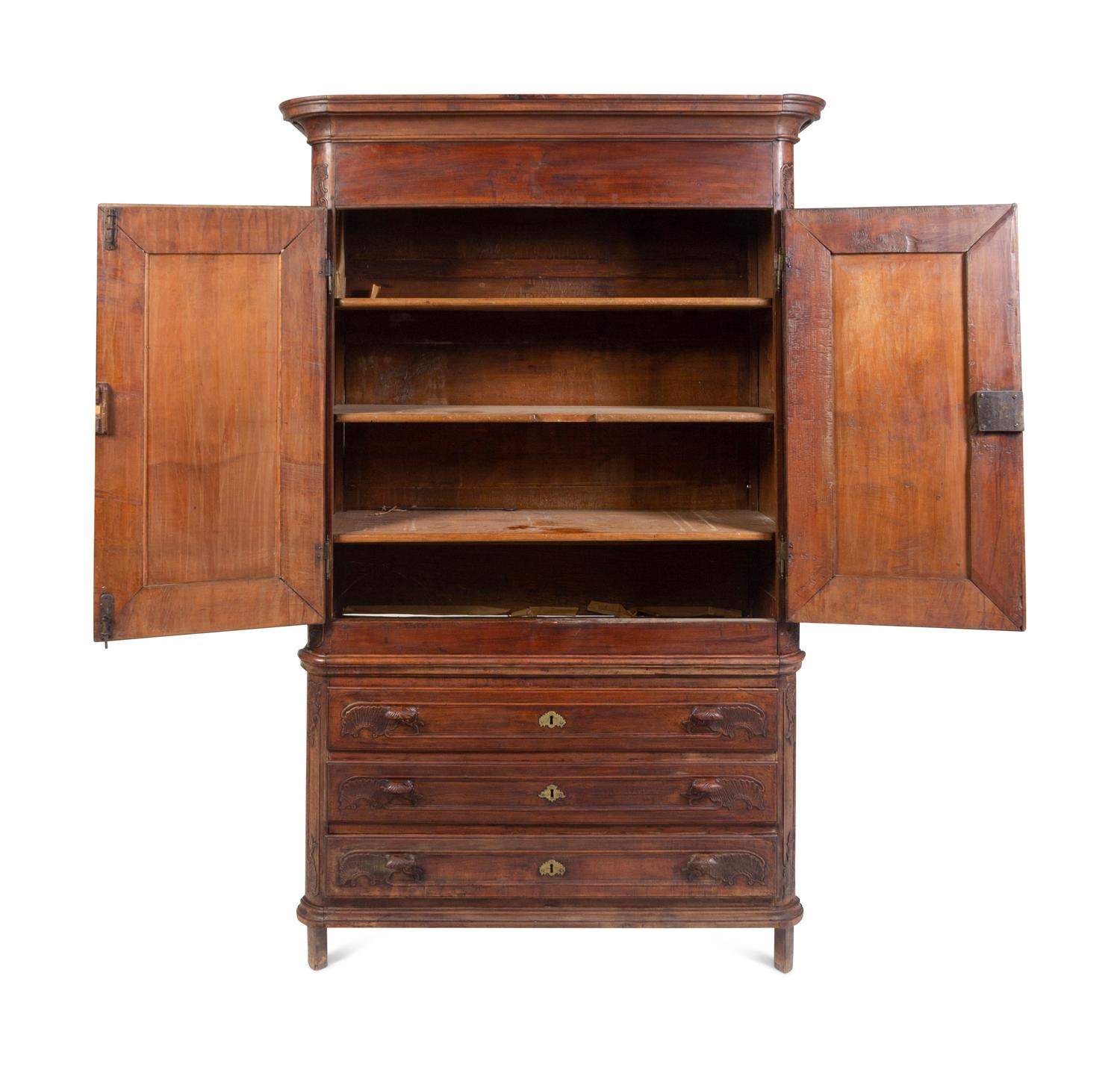 A Louis XV Carved Walnut Cabinet