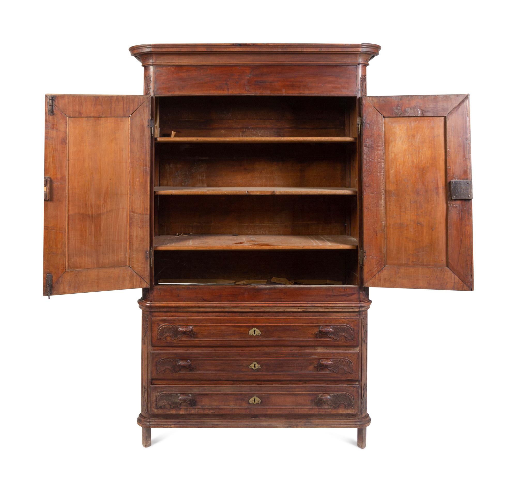 A Louis XV Carved Walnut Cabinet