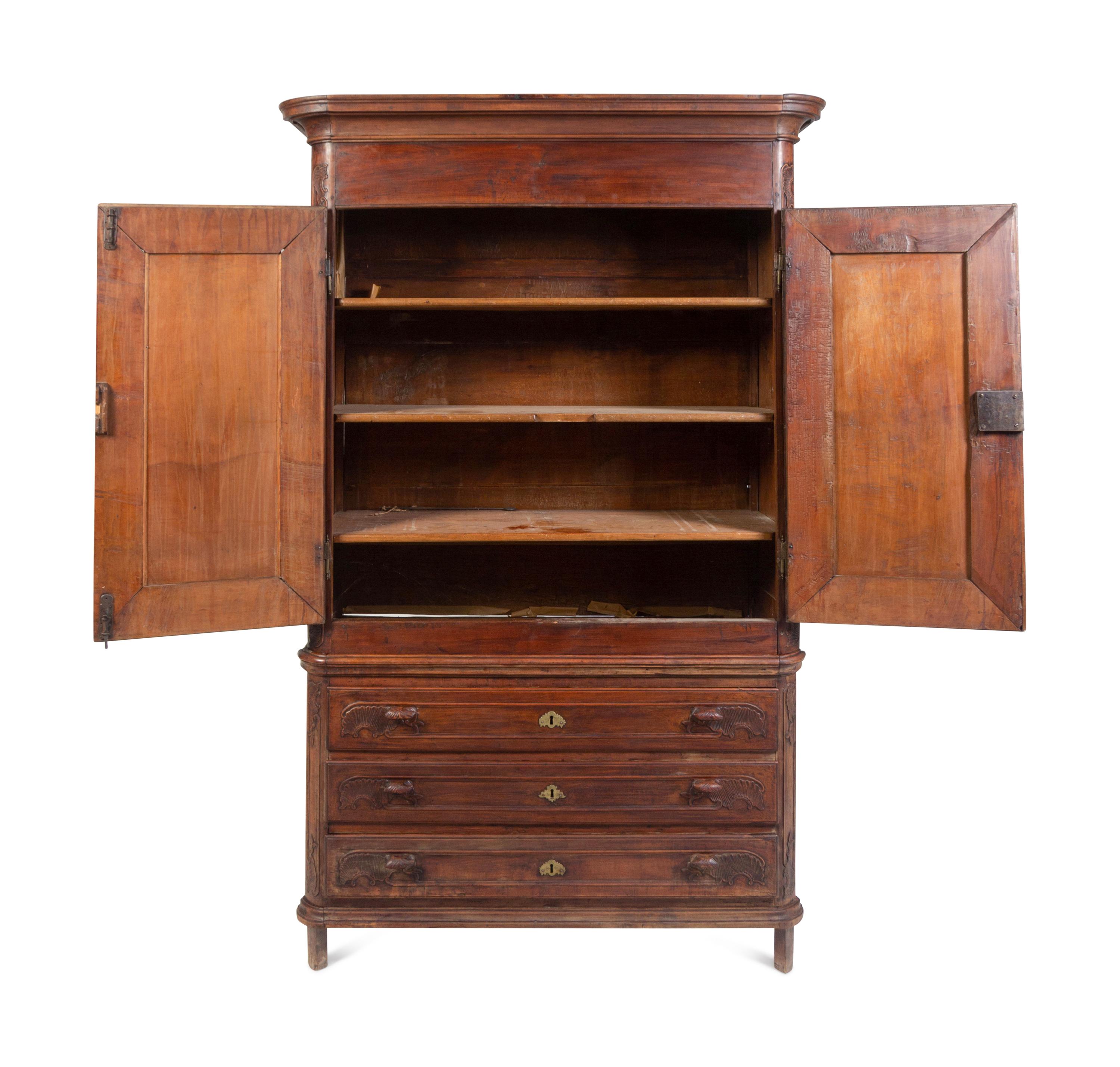 A Louis XV Carved Walnut Cabinet