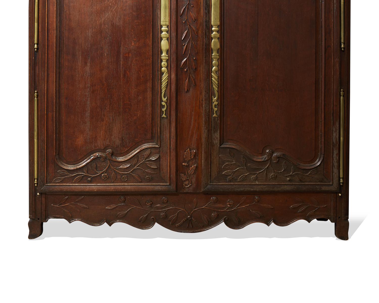A Louis XVI carved oak armoire, late 18th century