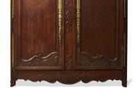 A Louis XVI carved oak armoire, late 18th century