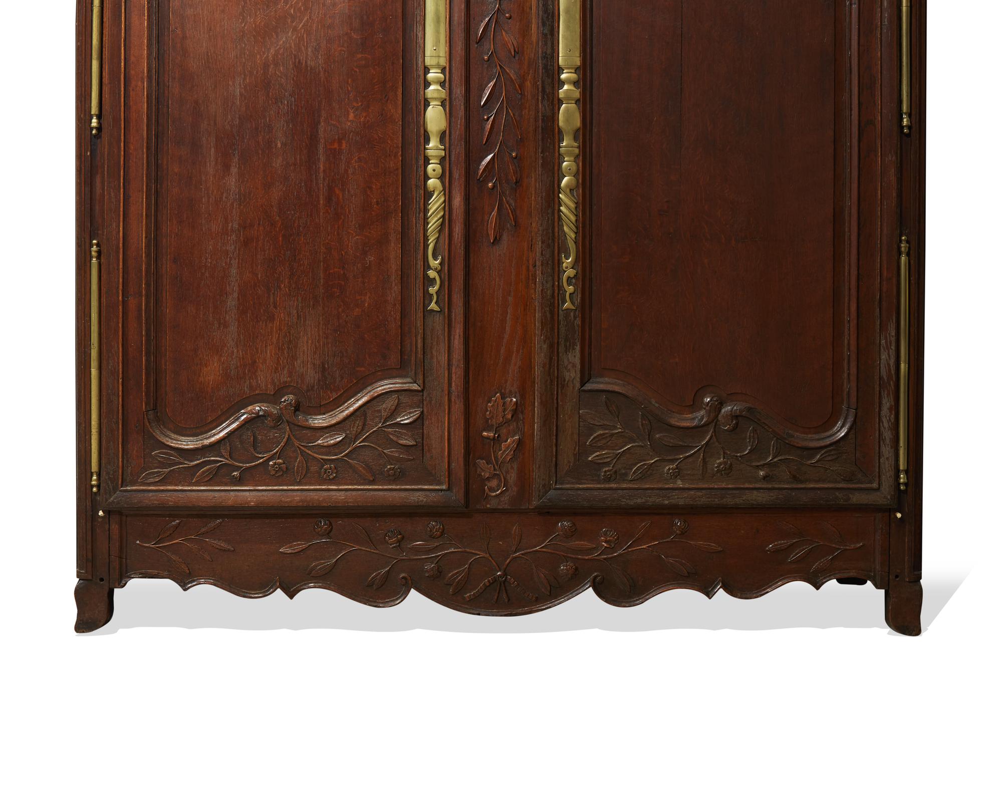A Louis XVI carved oak armoire, late 18th century