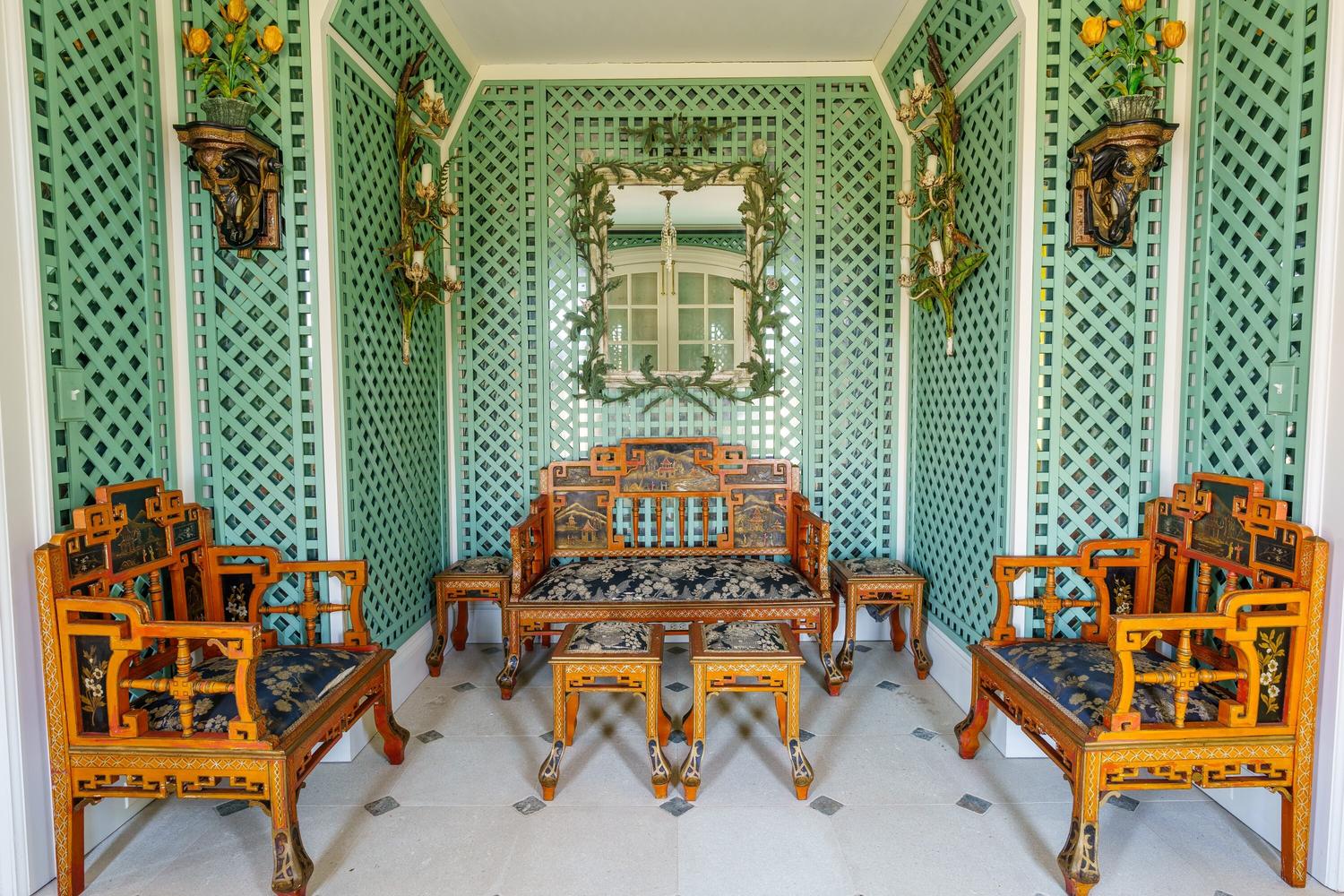 A Fornasetti Citta di Carte Table Top on Painted Wrought Iron Base