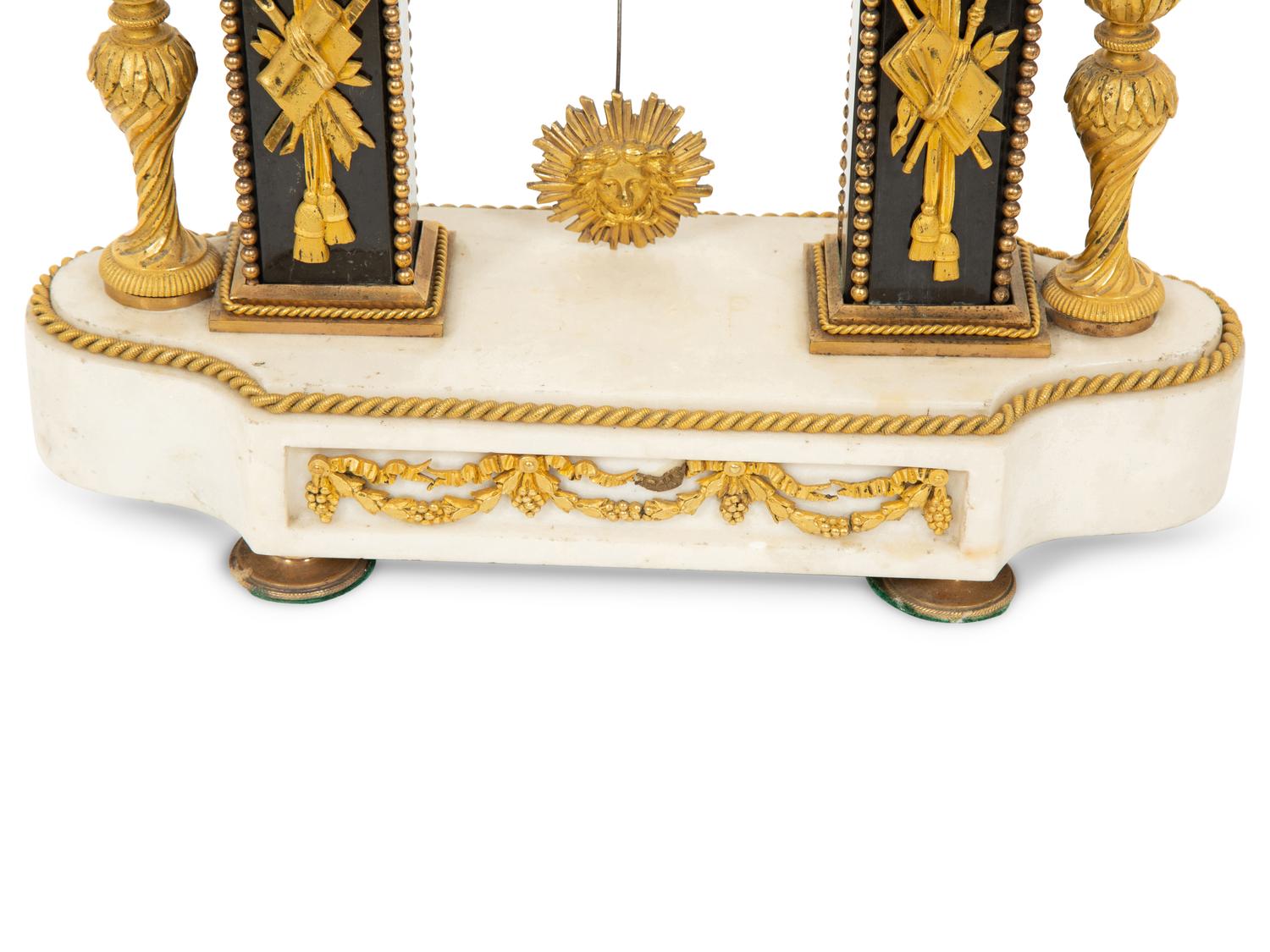 A Louis XVI Gilt Bronze and Marble Mantel Clock