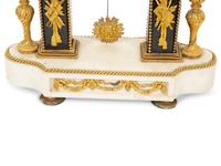 A Louis XVI Gilt Bronze and Marble Mantel Clock