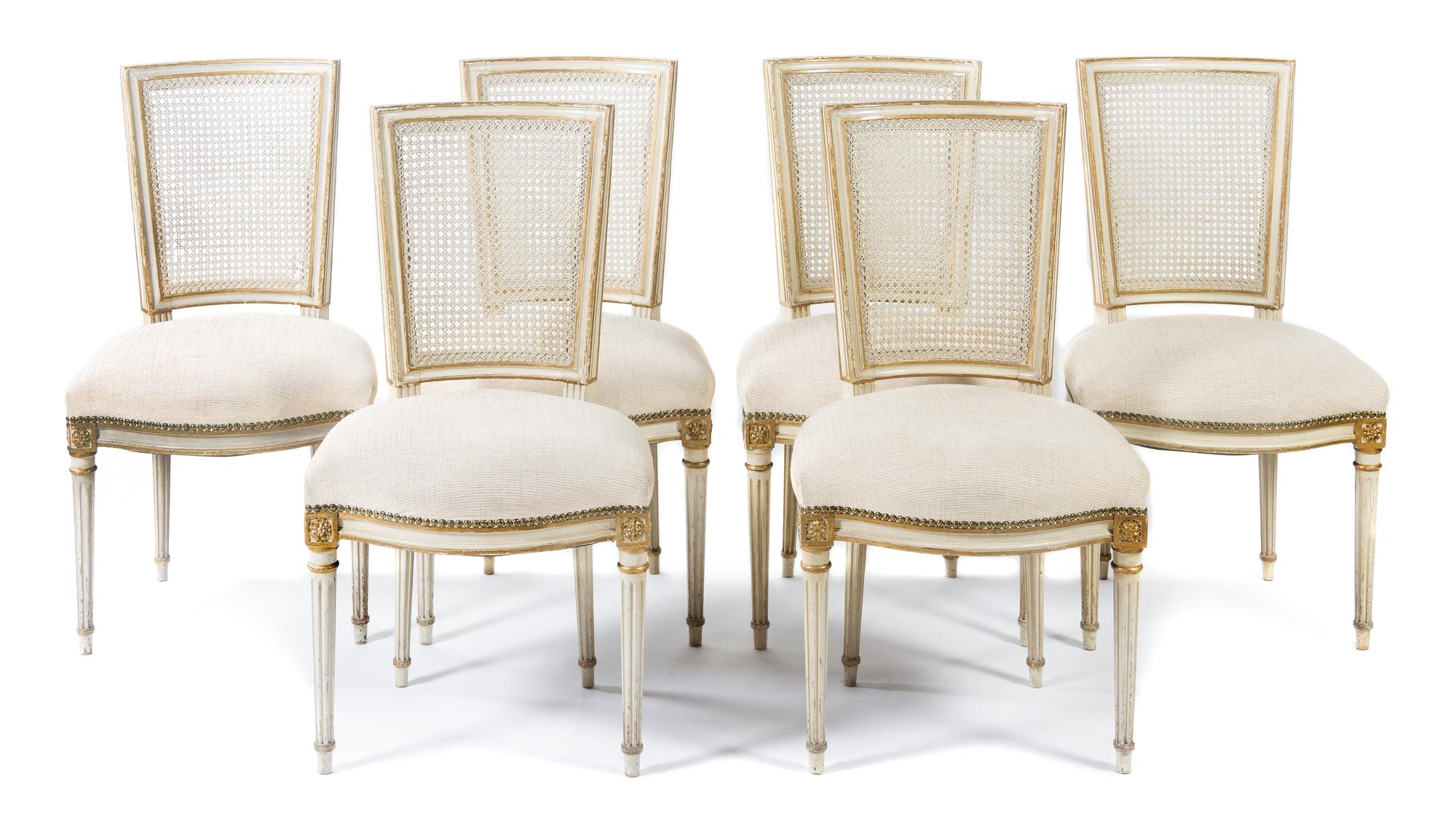 A Set of Six Louis XVI Style Painted and Parcel Gilt Dining Chairs Height 35 1/2 inches. — FIRST HALF 20TH CENTURY