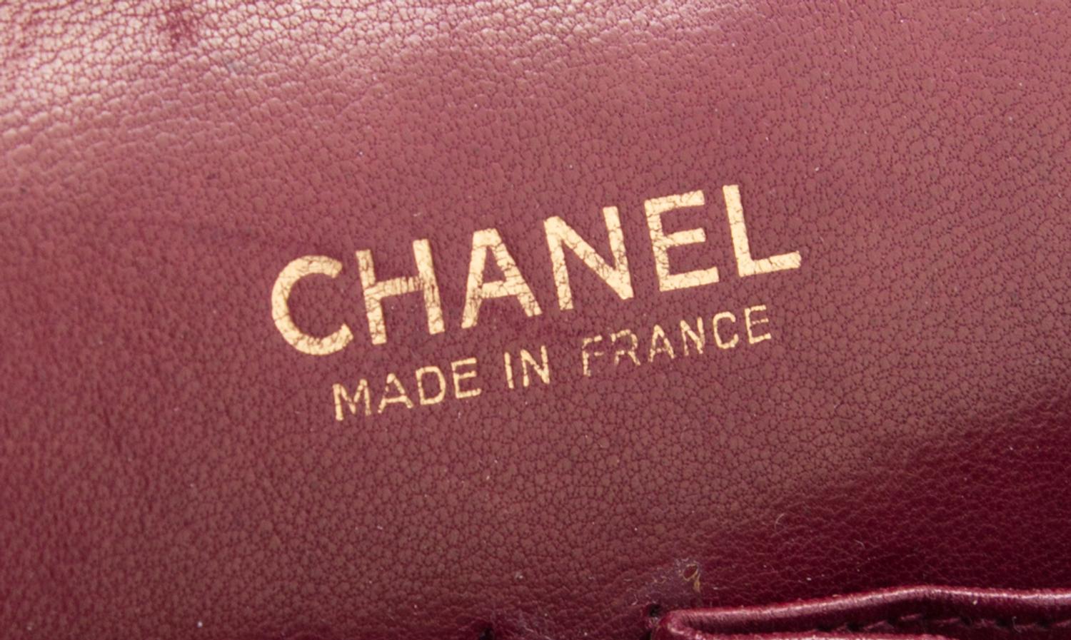 A Chanel Black Fabric Mademoiselle Double Flap Bag, 11" x 7" x 3".