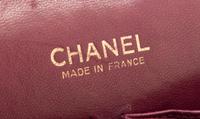 A Chanel Black Fabric Mademoiselle Double Flap Bag, 11" x 7" x 3".