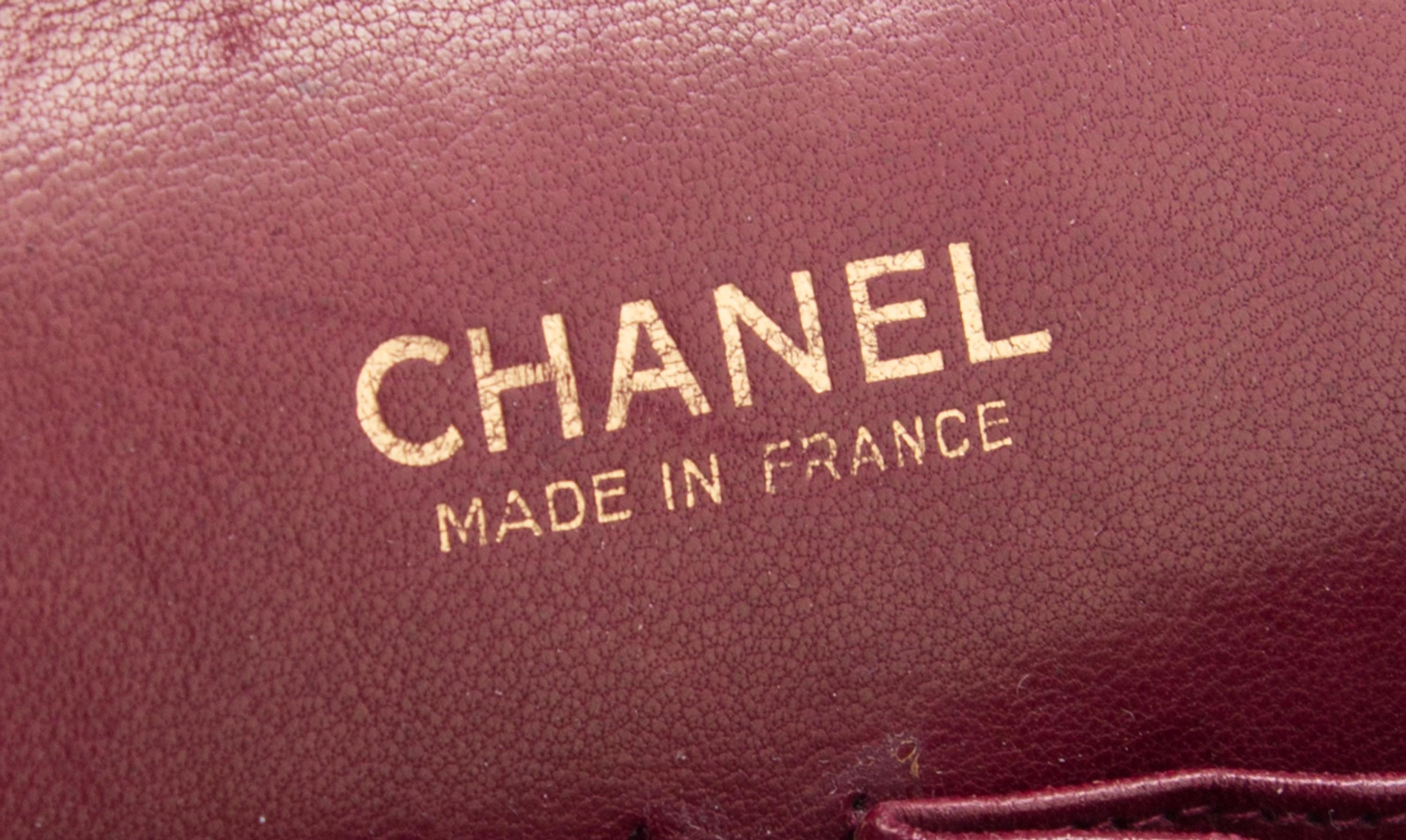 A Chanel Black Fabric Mademoiselle Double Flap Bag, 11" x 7" x 3".