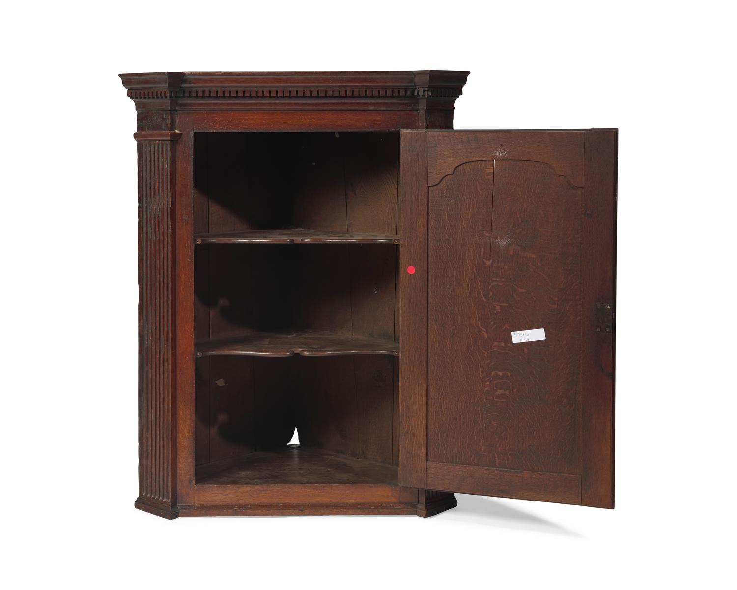 A George III Carved Oak Hanging Corner Cupboard