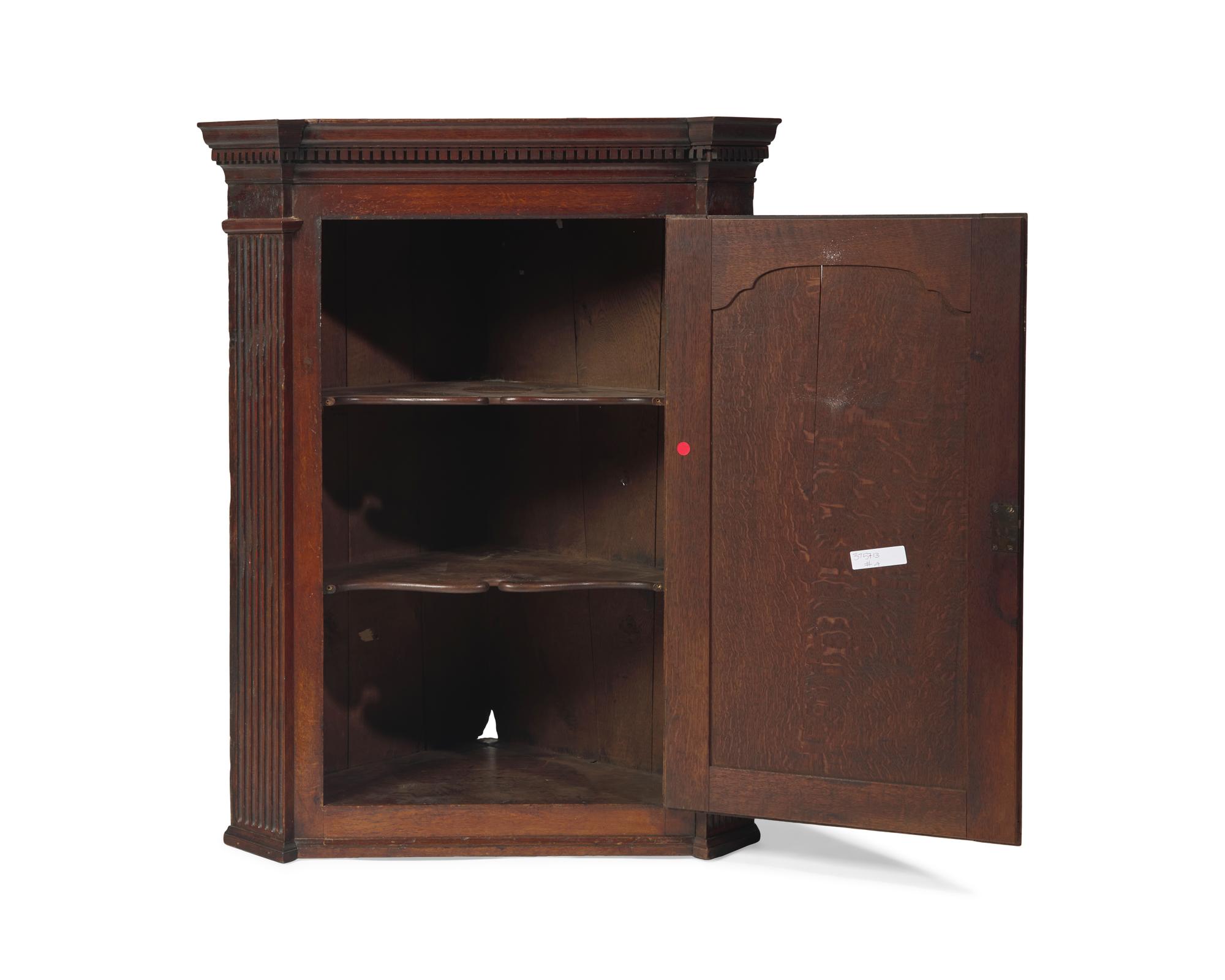 A George III Carved Oak Hanging Corner Cupboard