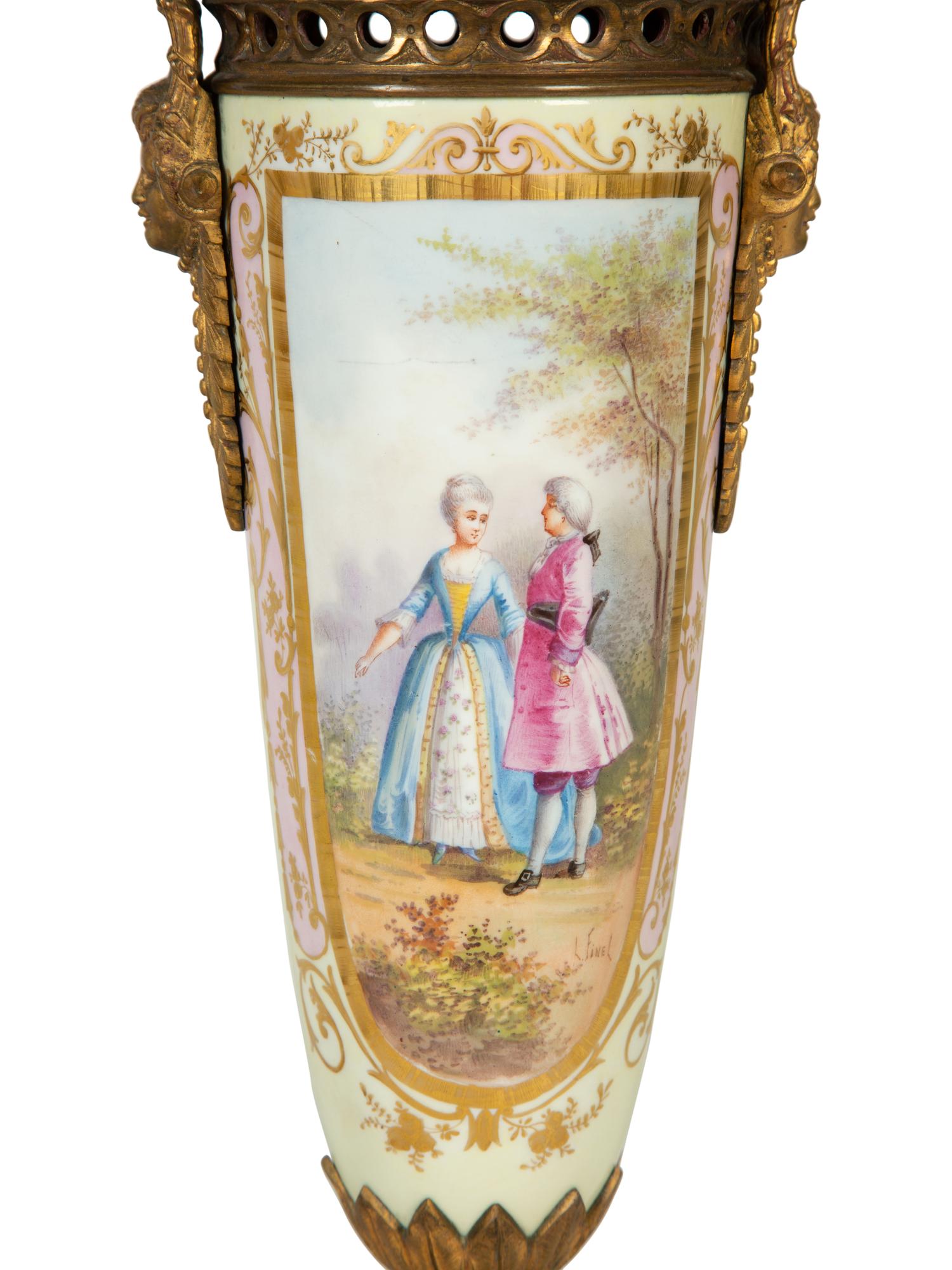 A Pair of Gilt Bronze Mounted Sèvres Style Porcelain Urns