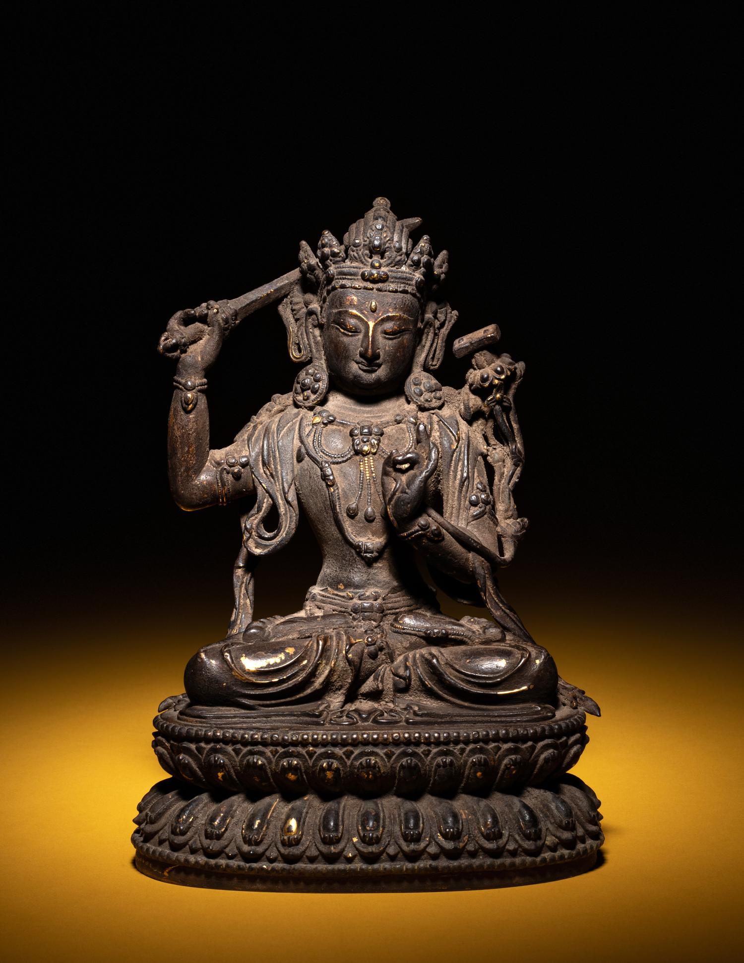 A Sino-Tibetan Parcel-Gilt Bronze Figure of Manjushri