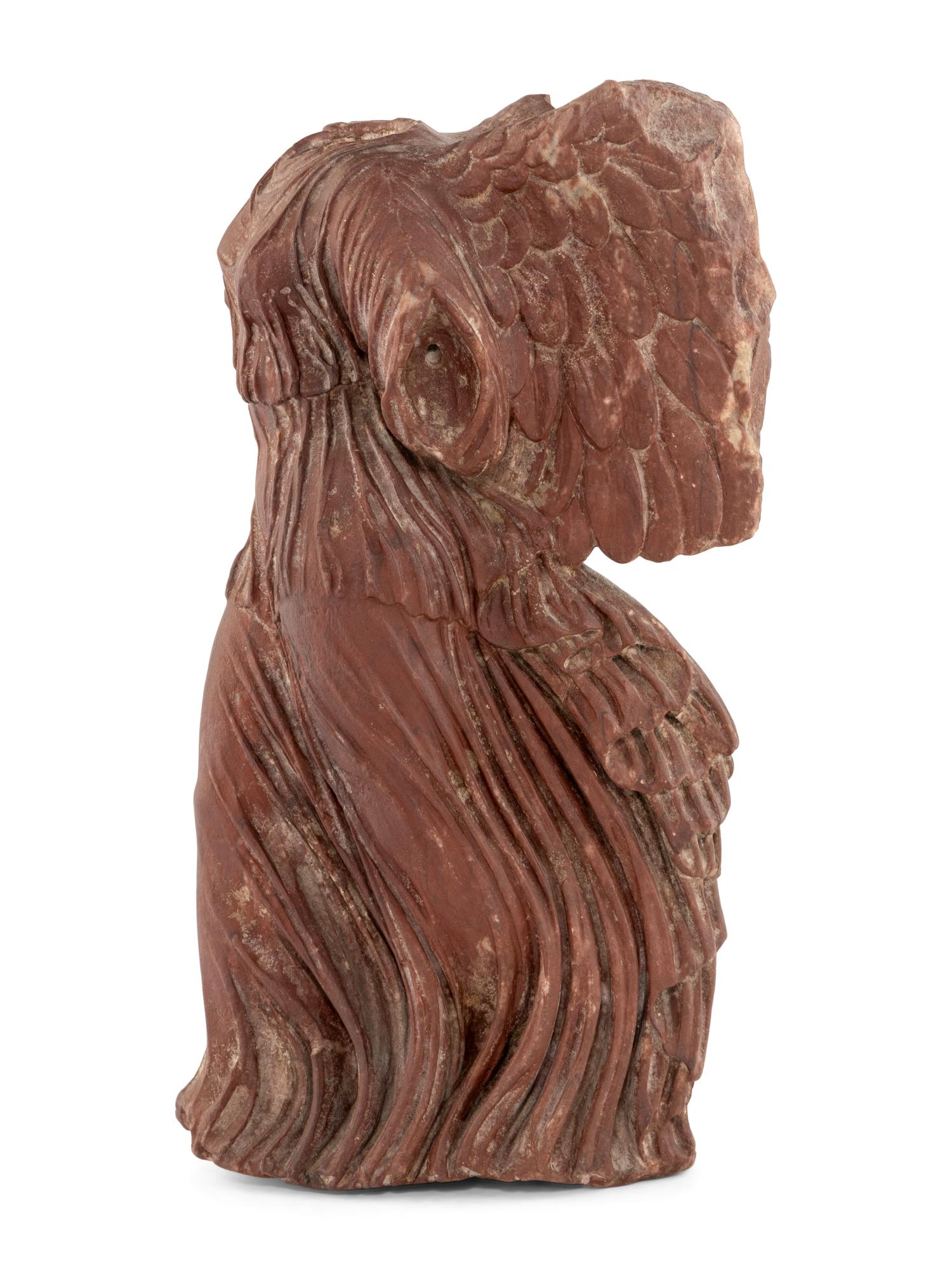 A Carved Red Marble Figure of the Nike of Samothrace