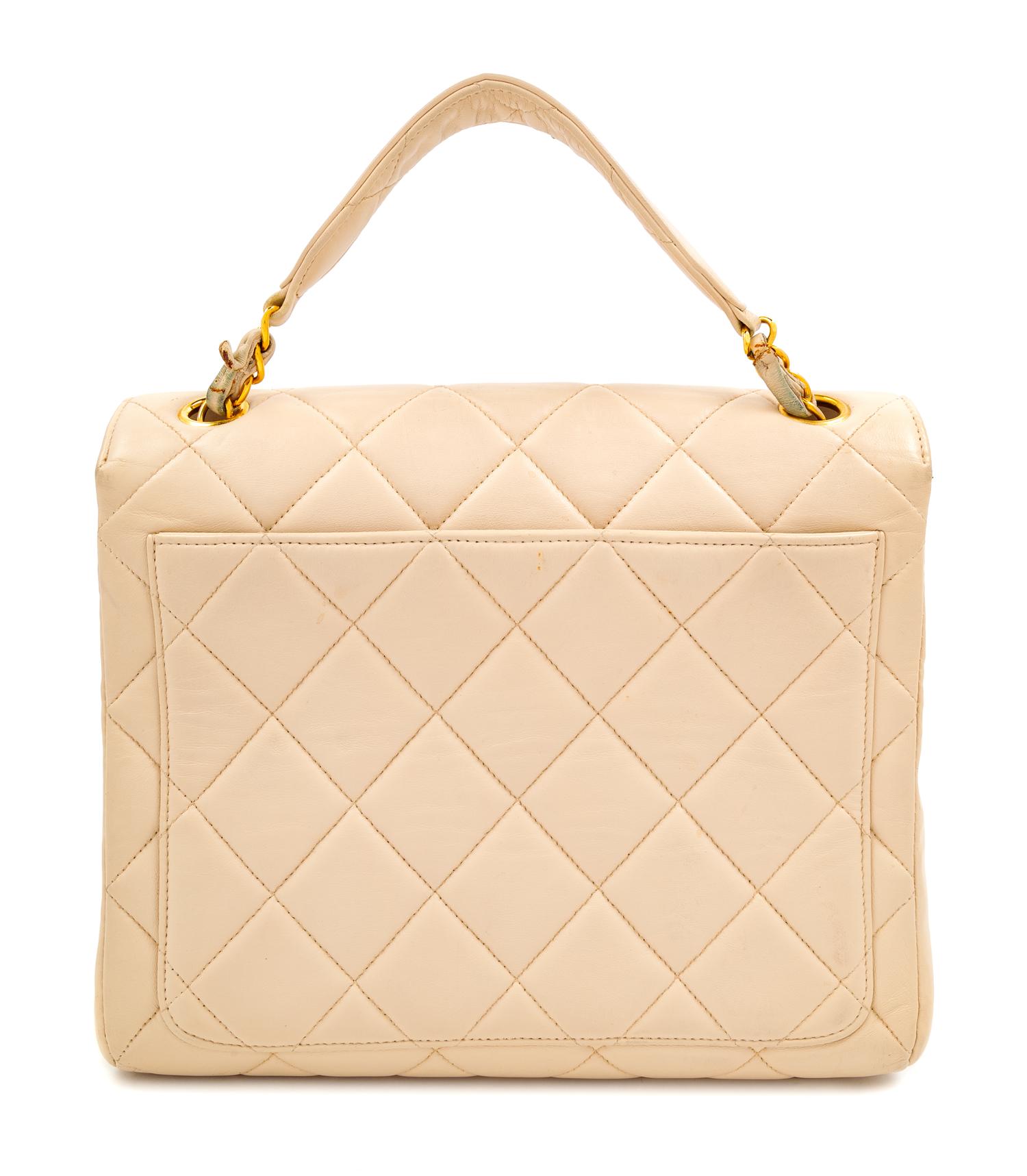 A Chanel Cream Lambskin Quilted Square Flap Bag, 8" H x 9.5" W x 3" D; Handle drop: 3".