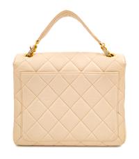 A Chanel Cream Lambskin Quilted Square Flap Bag, 8" H x 9.5" W x 3" D; Handle drop: 3".