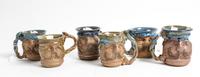 A Group of Six Anthropomorphic Ceramic Mugs