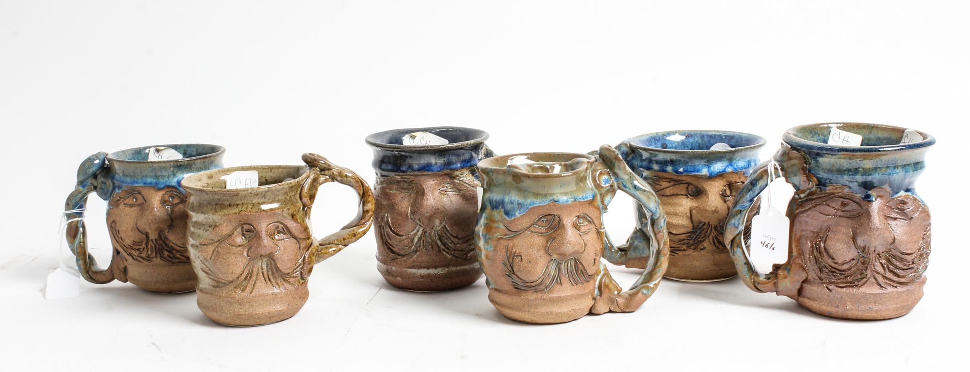 A Group of Six Anthropomorphic Ceramic Mugs