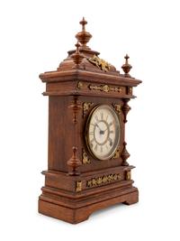 An Ansonia Cabinet A Brass Mounted Oak Shelf Clock