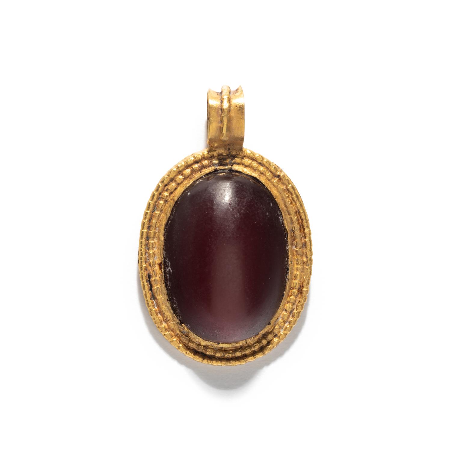 A Roman Gold and Carnelian Cabochon Pendant