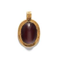 A Roman Gold and Carnelian Cabochon Pendant