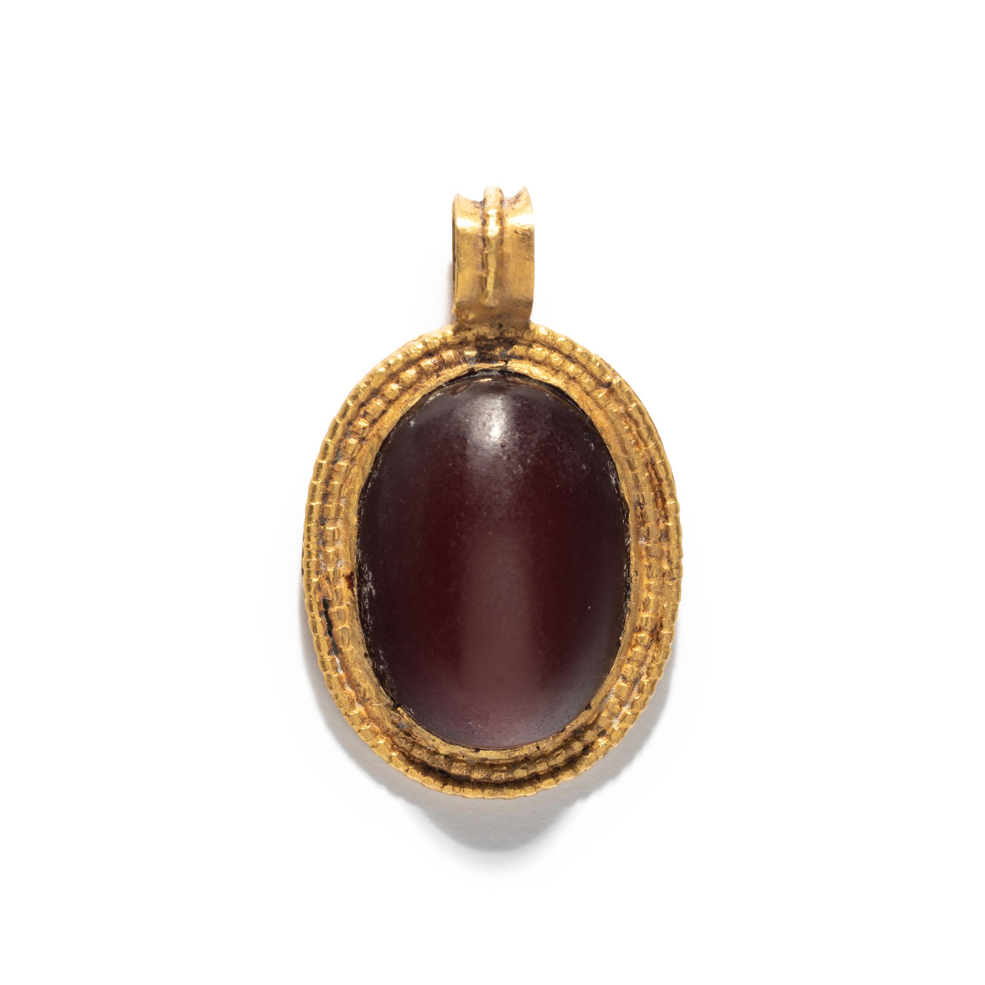 A Roman Gold and Carnelian Cabochon Pendant