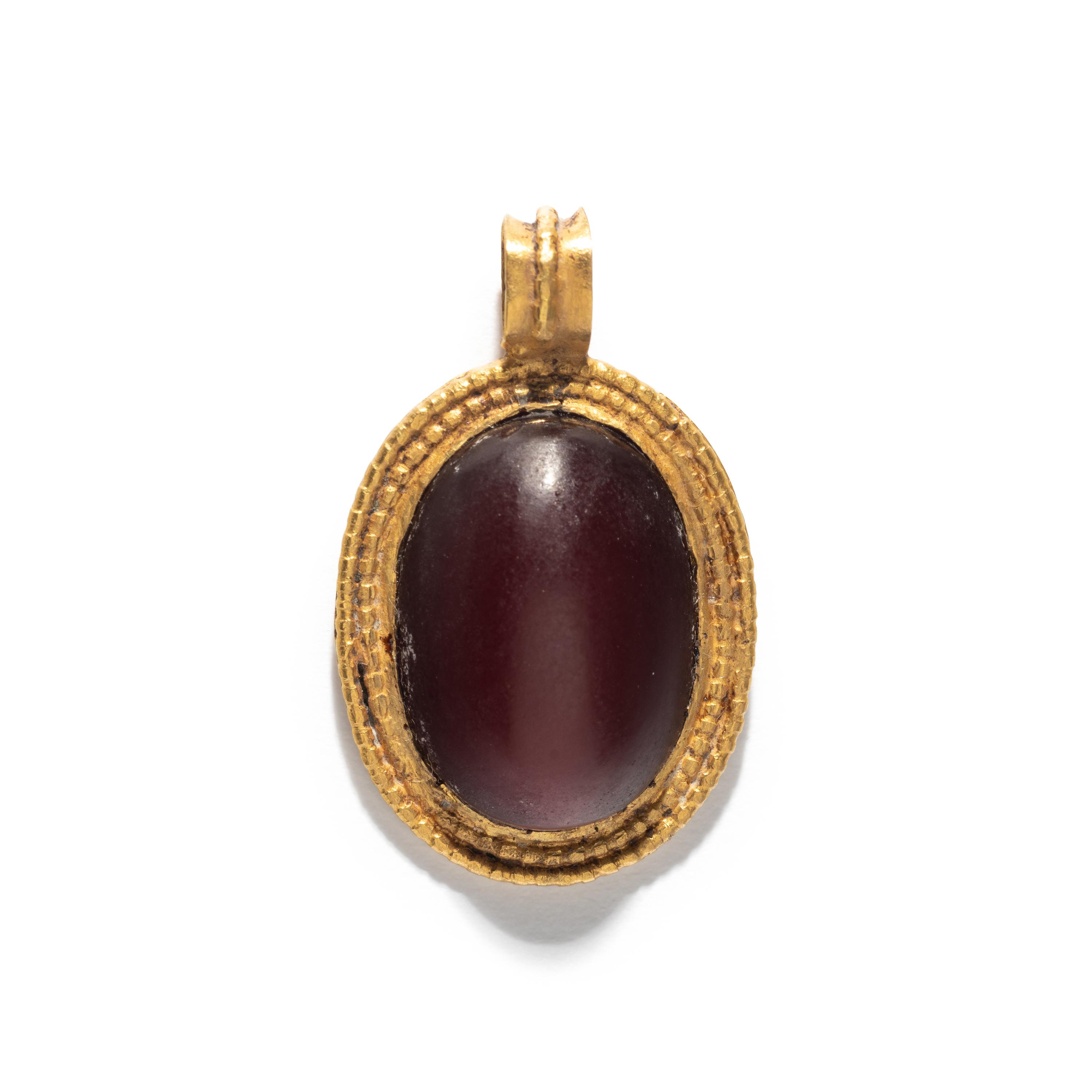 A Roman Gold and Carnelian Cabochon Pendant