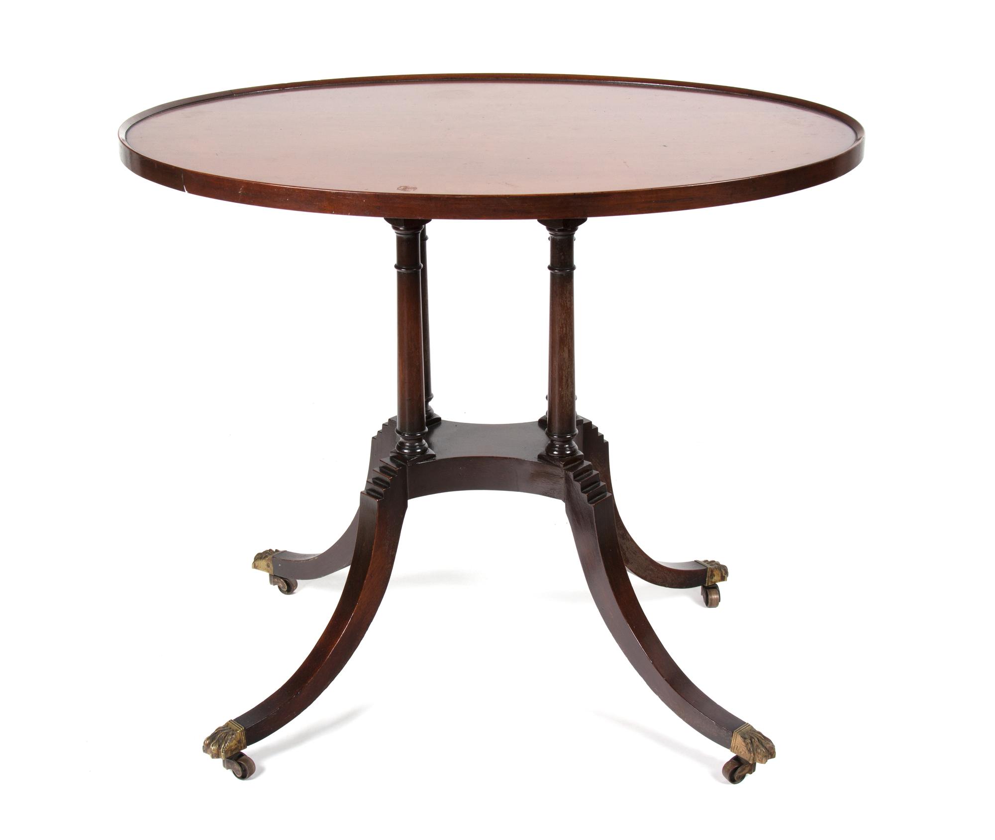 A Regency Style Oval Top Tea Table Height 28 3/4 x width 34 x depth 24 inches. — 20TH CENTURY