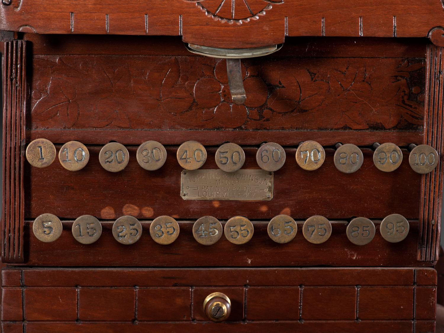 A Carved Wood Change Machine