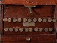 A Carved Wood Change Machine