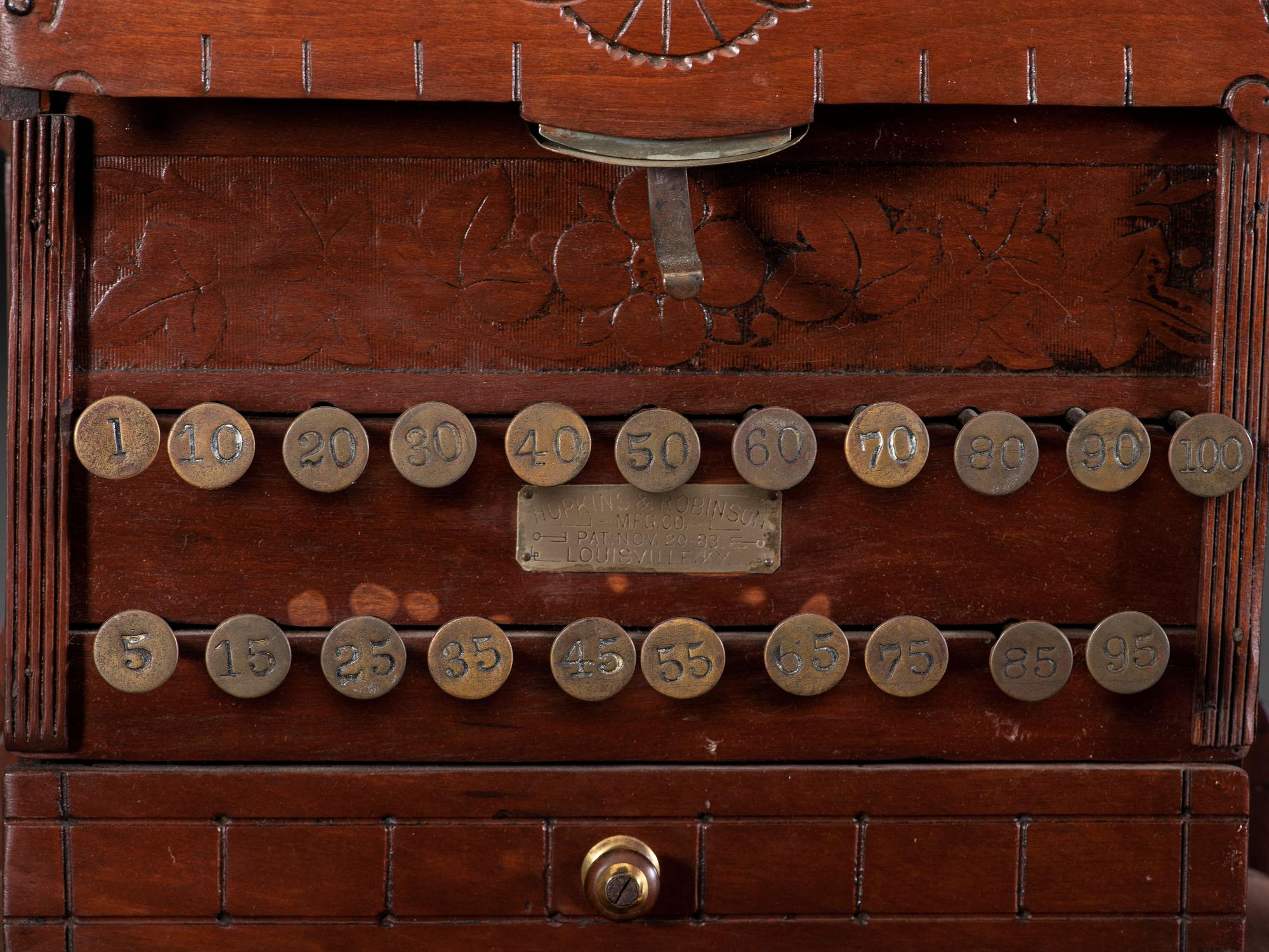 A Carved Wood Change Machine