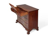 A Chippendale Cherry Oxbow Chest of Drawers