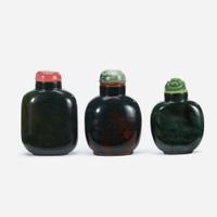 Three Chinese green hardstone snuff bottles