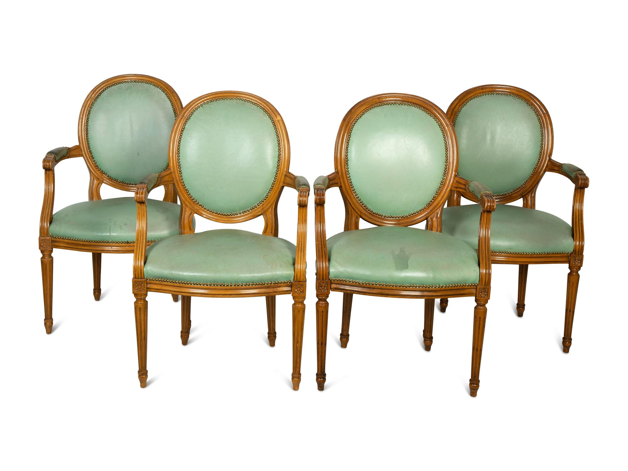 A Set of Four Louis XVI Style Leather-Upholstered Fauteuils