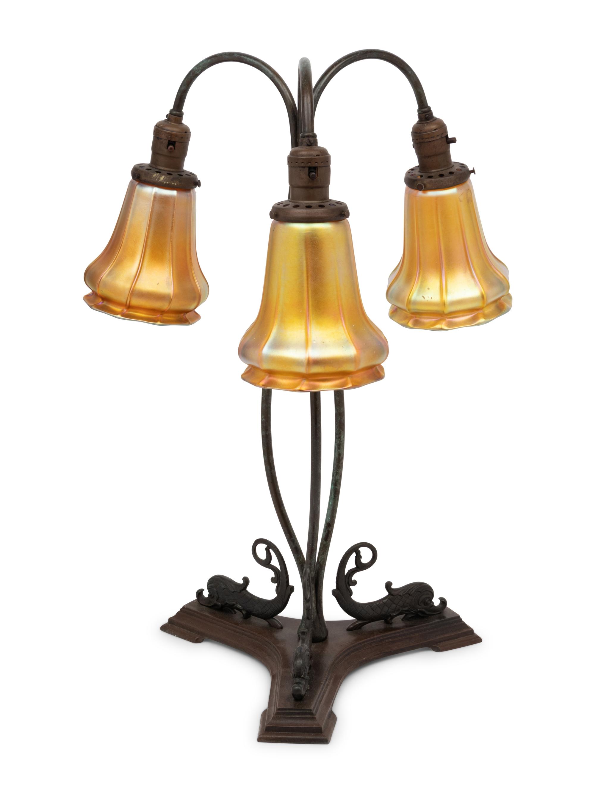 A Cast Metal Three-Light Lamp with Quezal Aurene Glass Shades