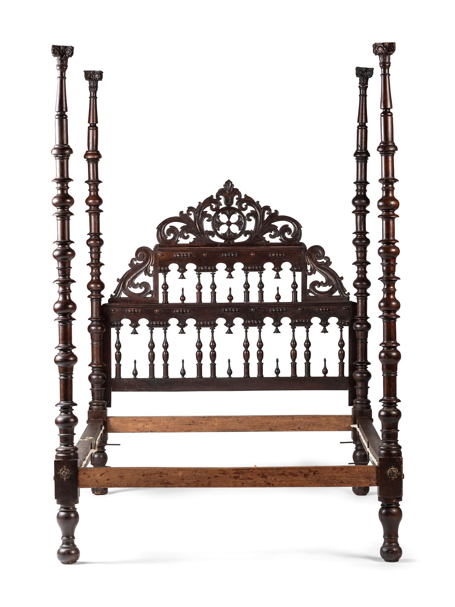 A Gothic Revival Walnut Four Poster Bed