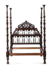A Gothic Revival Walnut Four Poster Bed