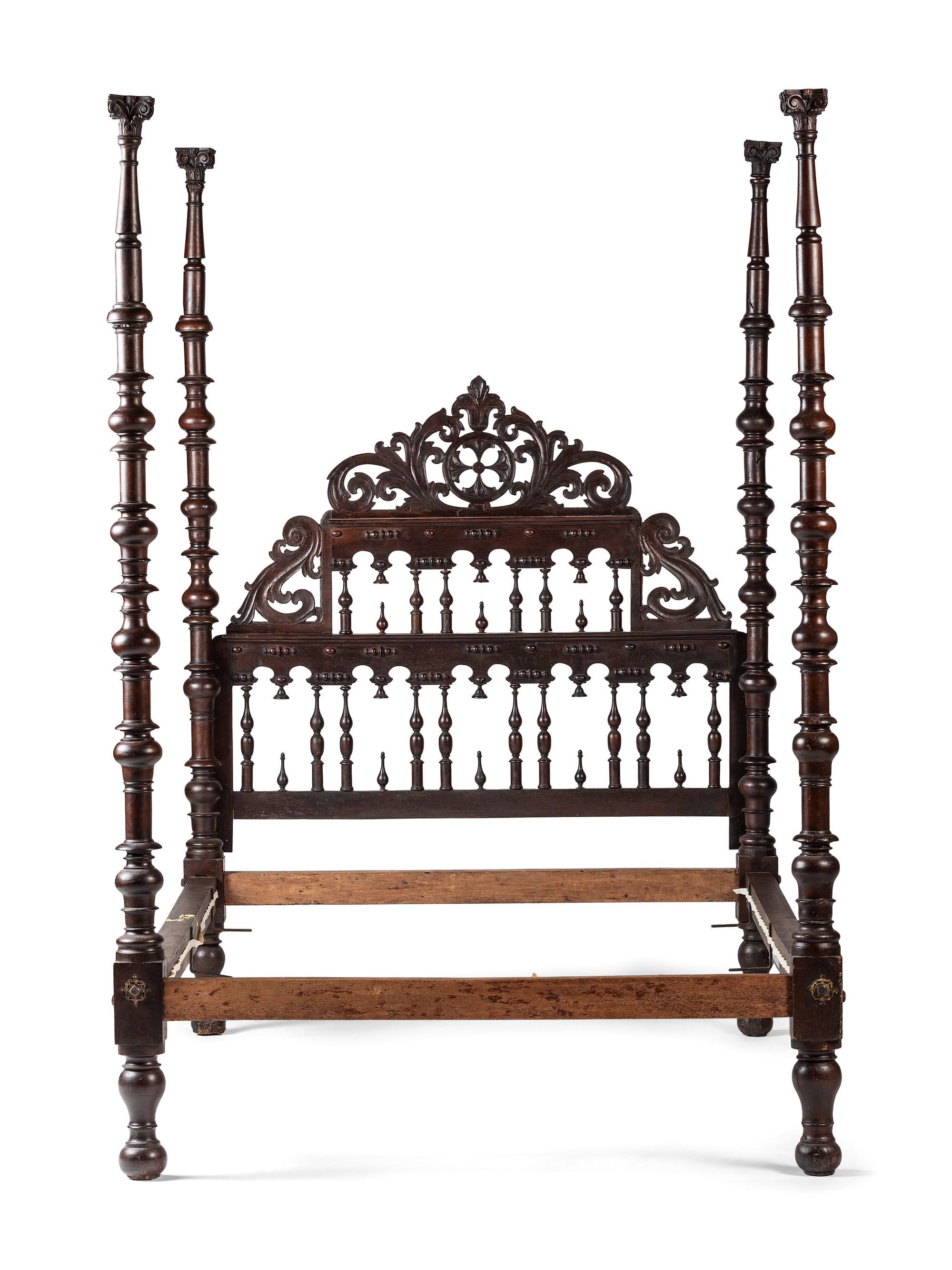 A Gothic Revival Walnut Four Poster Bed