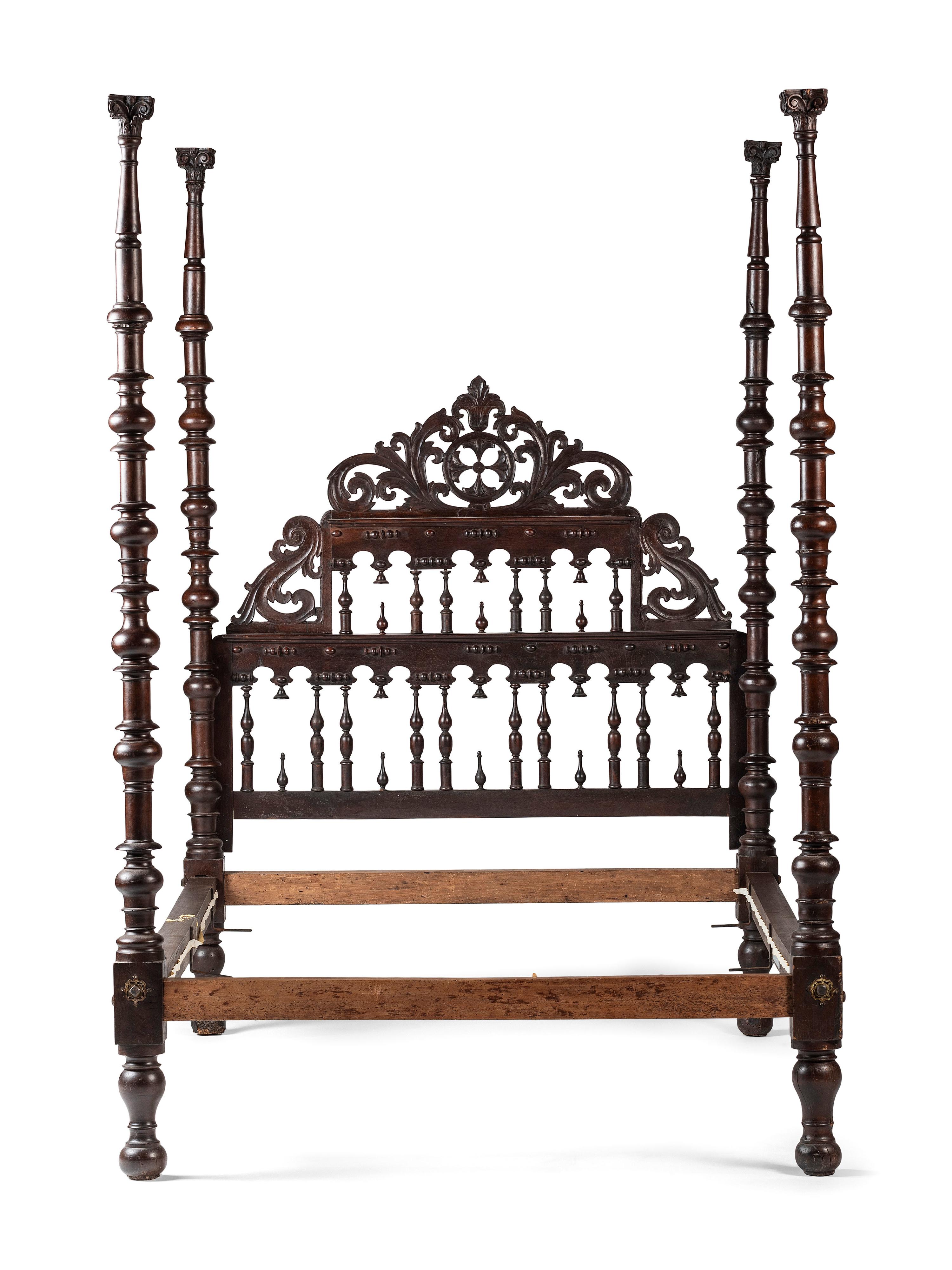 A Gothic Revival Walnut Four Poster Bed