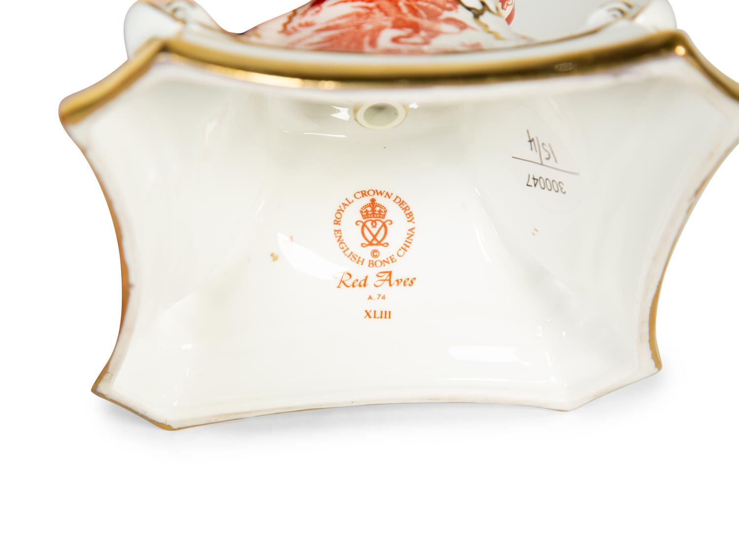 A Royal Crown Derby Red Aves Covered Tureen with Under Plate and a Pair of Candlesticks