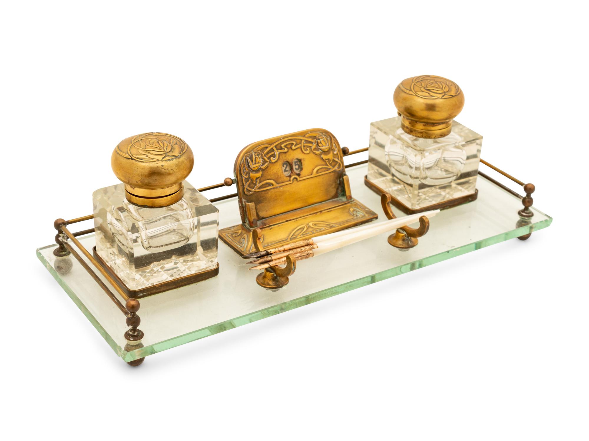 A Group of American Art Nouveau Brass and Glass Inkstands