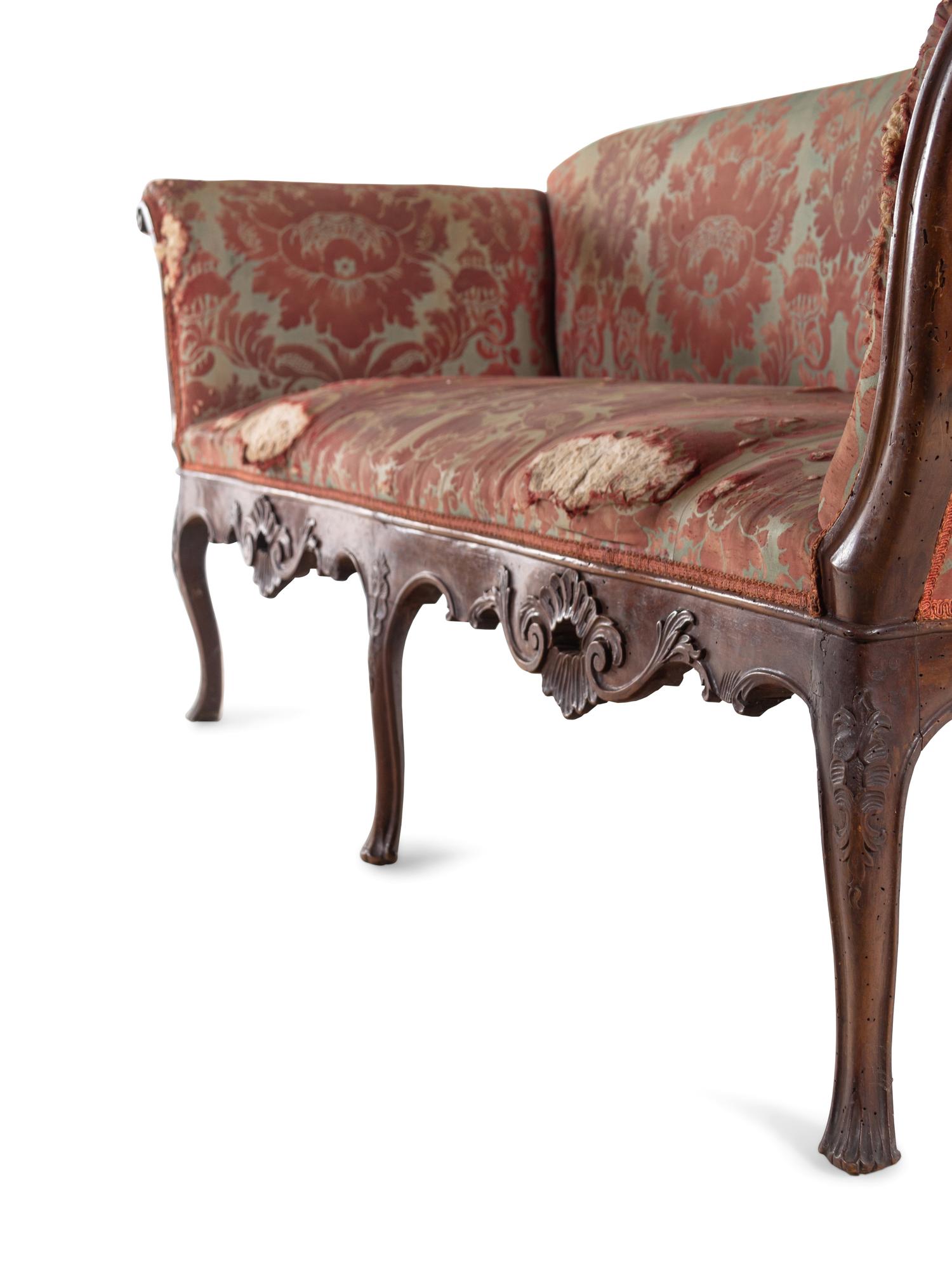 An Italian Carved Walnut Sofa