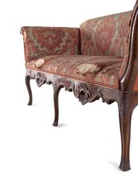 An Italian Carved Walnut Sofa